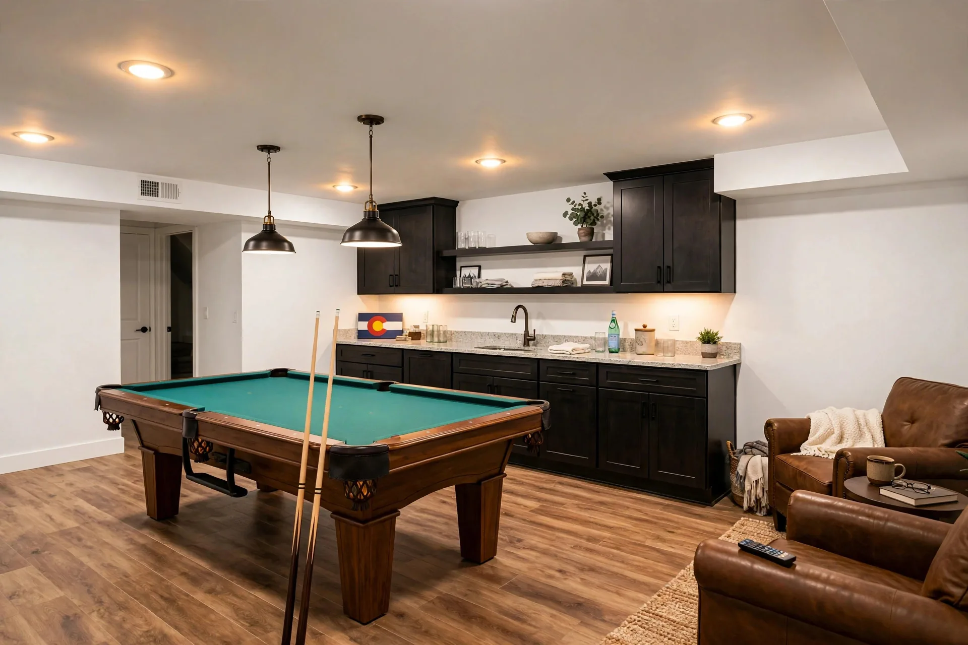 Finished basement game room with pool table and wet bar
