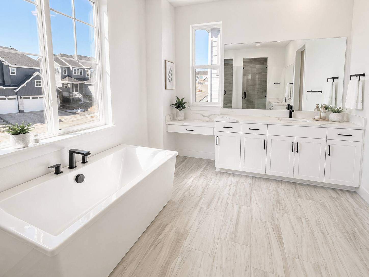 Bright bathroom with freestanding tub and double vanity