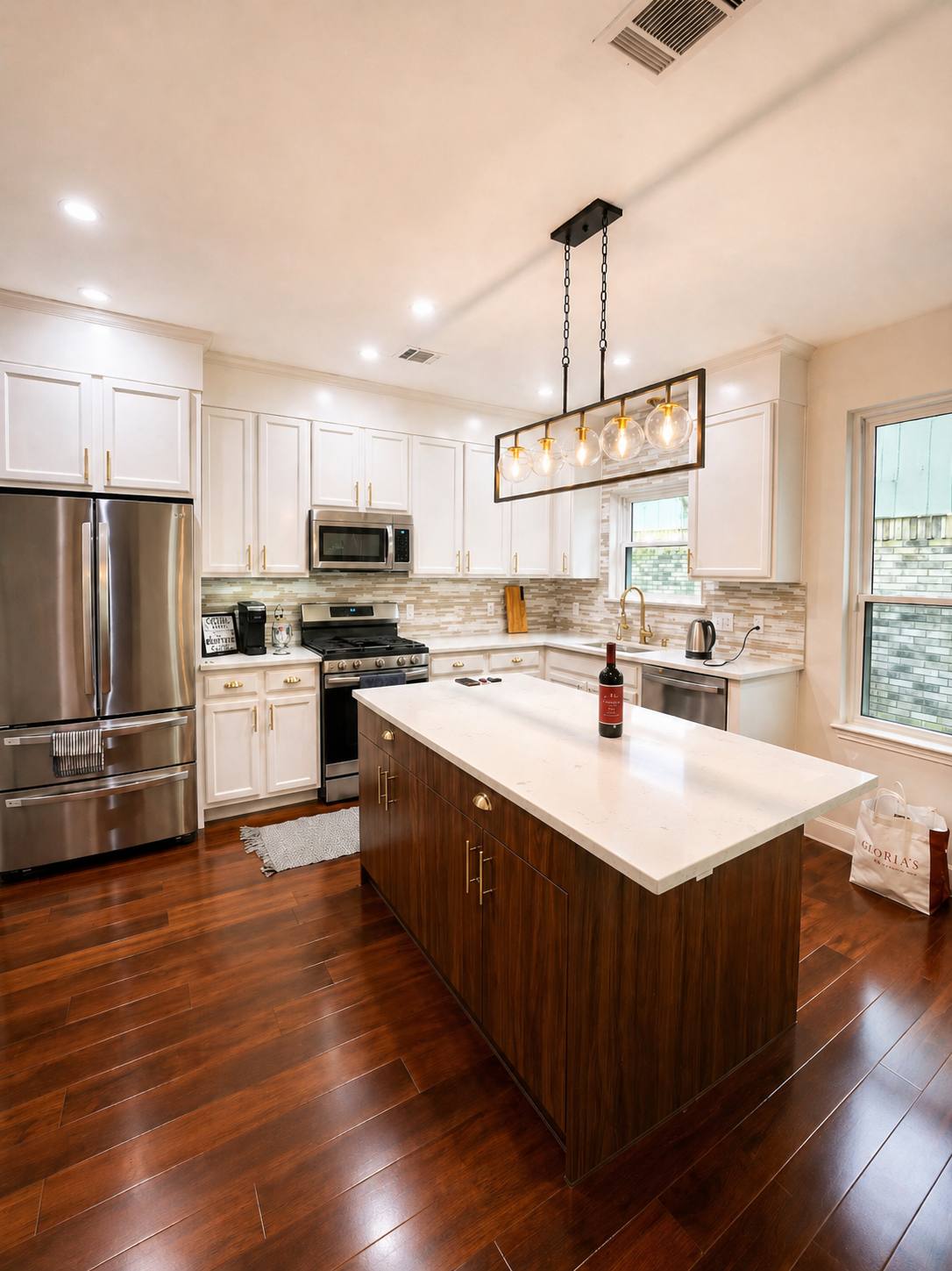 Kitchen with wood island and pendant lights